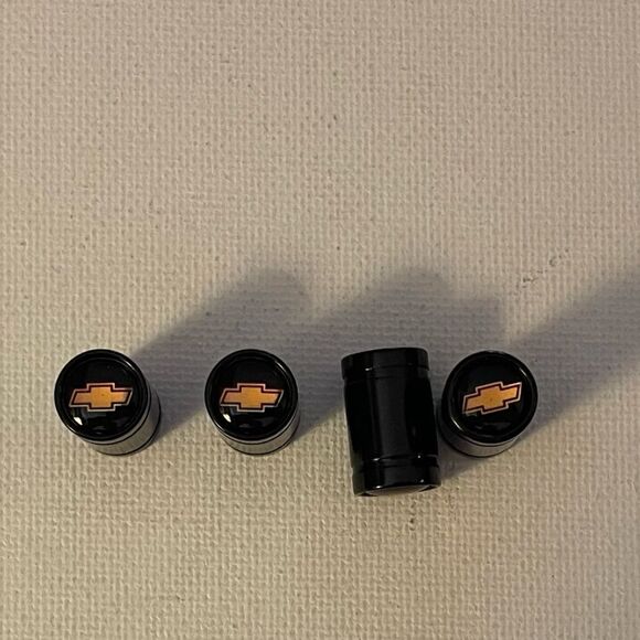 Chevrolet valve Stem caps in black set of 4 with Logo NWT - Picture 1 of 5